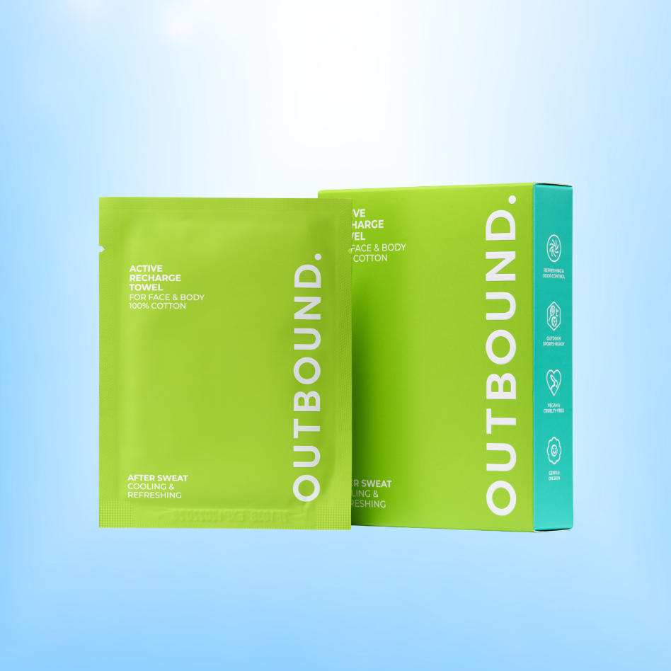 OUTBOUND Active Recharge Towel refreshing and cooling face and body towel packet with green box on a blue background