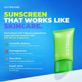 A bright green OUTBOUND sunscreen tube on a blue promotional background with large text reading 'SUNSCREEN THAT WORKS LIKE SKINCARE.' and ingredient callouts for Centella Asiatica, Pomegranate, Rice Bran, and Fresh Mint.