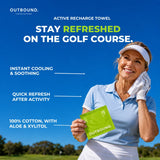 A senior woman golfer in a light blue polo shirt and white visor holds an OUTBOUND active recharge towel packet on a golf course under a bright blue sky. Text on the image highlights instant cooling, quick refresh after activity, and 100% cotton with Aloe & Xylitol.